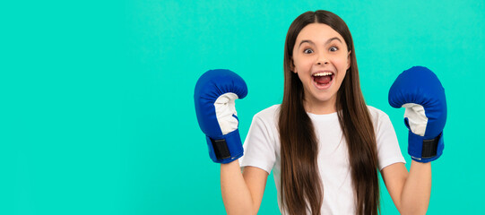 surprised teen girl boxer in boxing gloves during sport training, sport success. Horizontal poster...