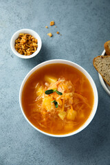 Traditional homemade sauerkraut soup with fresh parsley