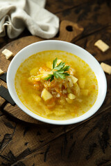 Traditional homemade sauerkraut soup with fresh parsley