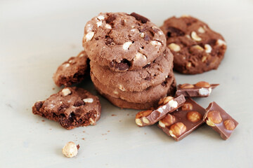 Delicious cookies with chocolate lay on a table