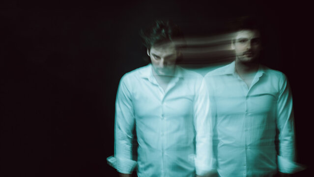 abstract blurry portrait of a man with mental and depressive illness with bipolar disorder
