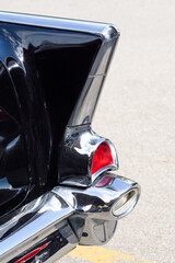 Fototapeta premium red tail light on vintage black and silver car