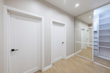 Fototapeta na wymiar Interior design of a bright corridor with stylish furniture. Cleanliness and order