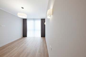 Interior design of a room with light walls and a window. empty and clean