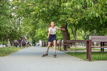 Teen girl rollerblading fast at skate park. Having fun. Concept of an active lifestyle and childhood