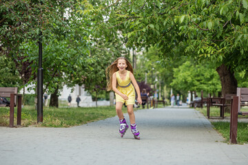 Child rollerblading fast at skate park. Having fun. Concept of an active lifestyle and childhood