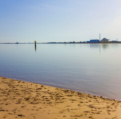 Atomic nuclear power station wadden sea tidelands coast landscape Germany.