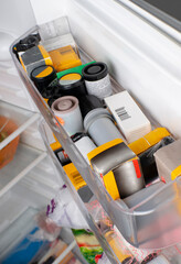films in packages for cameras in the refrigerator door. storage example