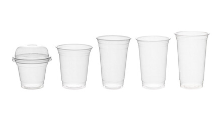 Disposable clear plastic cup standing in isolated environment