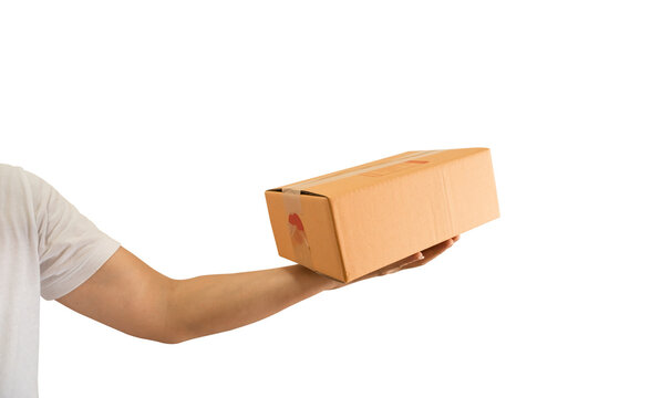 Delivery man hand holding parcel cardboard box on transparent background - PNG format.