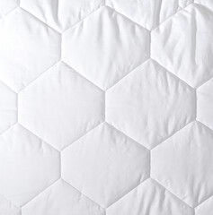 fragment of stitches of a white quilt. stitch example and pattern volume