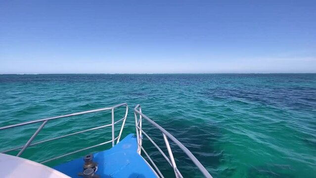 Front view of empty peacefull ocean from sailing boat and clear blue sky