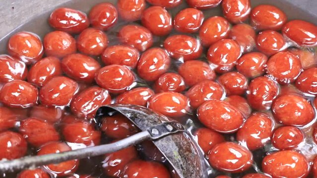 Red Sweet Rosogolla Gulab Jamun Making is A Bangladeshi Traditional food 