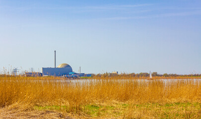 Atomic nuclear power station wadden sea tidelands coast landscape Germany.