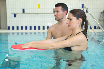 a woman learning to swim