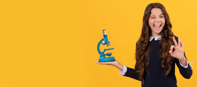 chemistry laboratory. research education. ok. happy scientist kid with microscope. Portrait of school girl student, studio banner header. School child pupil face, copy space. - Powered by Adobe