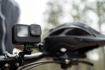 An action camera for photos and videos is installed on an extreme sports bike