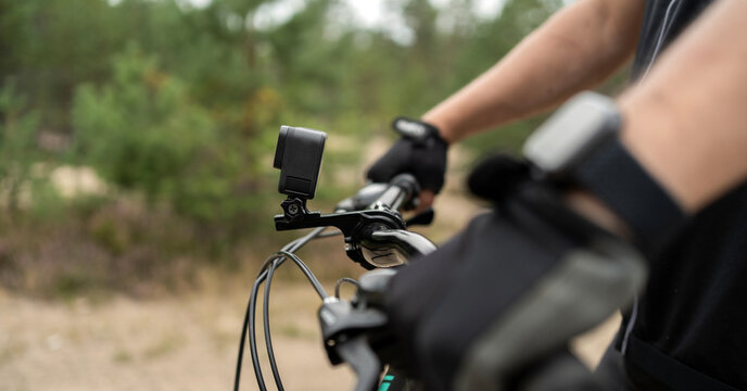 An action camera for photos and videos is installed on a bicycle