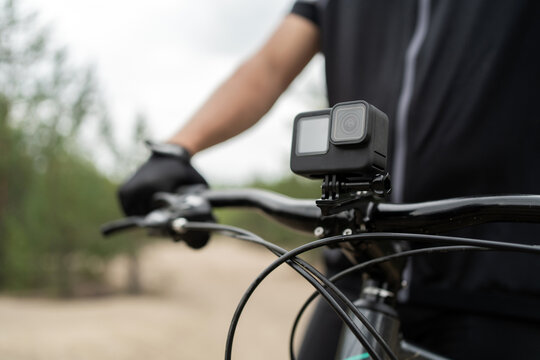 An action camera for photos and videos is installed on a bicycle