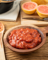 Goiabada, traditional brazilian creamy guava sweet with fruits over wooden table