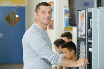 portrait of a man getting a coffee