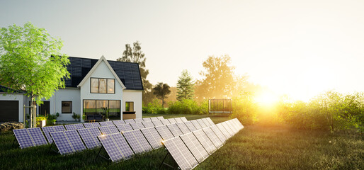 Solaranlage auf Wiese vor Einfamilienhaus