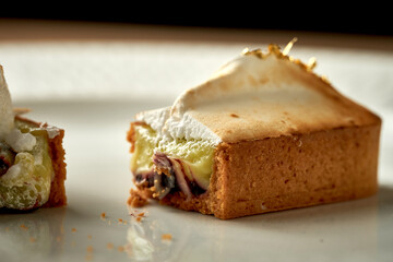 Tart with custard in a plate. Close-up. Selective focus. Noise added in post-production