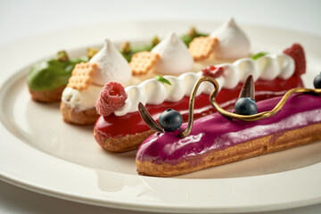 A set of different eclairs with filling. Selective focus, close-up