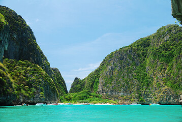 Plakat Beautiful landscape of clear blue sea with mountain in the background. The sea in the southern part of Thailand.
