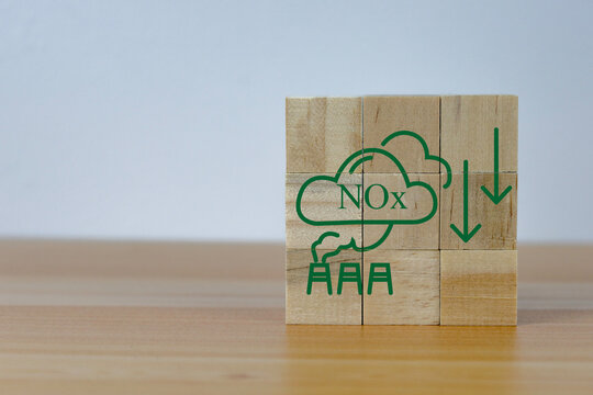 Icon On Wooden Cubes With NOx Emission Reduction Icon For  NOx Emission ,green Industries Business. Net Zero Emissions. Renewable Energy, Sustainable Technology, Ecology Solutions Concept,