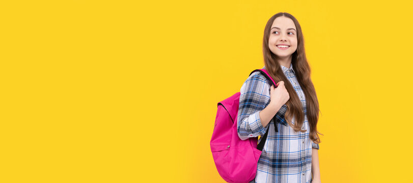 concept of education. kid in checkered shirt on yellow background. september 1. Horizontal isolated poster of school girl student. Banner header portrait of schoolgirl copy space.