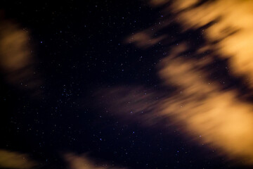 Stars in space, real photography with moving clouds
