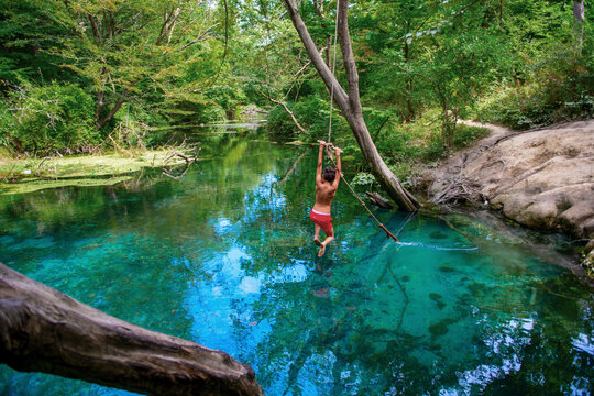 Incredibly beautiful fabulous place in Azerbaijan Nabran region river with incredible pure crystal water icy people jumping from a rope