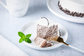 Eating chocolate cheesecake. Taking bite of cheesecake with fork
