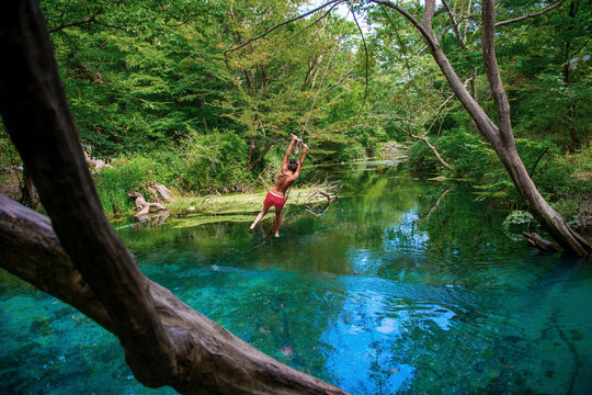 Incredibly beautiful fabulous place in Azerbaijan Nabran region river with incredible pure crystal water icy people jumping from a rope
