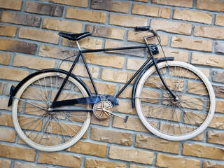 Fototapeta na wymiar Retro bike on the background of a brick wall