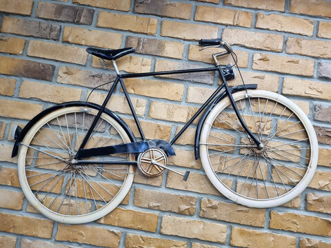 Retro bike on the background of a brick wall