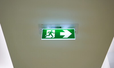 fire exit sign with arrow