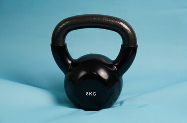 Fototapeta na wymiar kettlebell for weight fitness on blue background