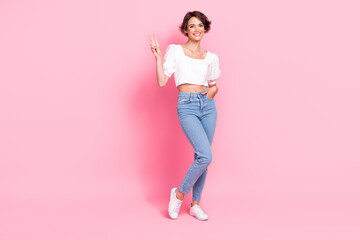 Full length photo of dreamy sweet lady wear white crop top showing v-sign empty space isolated pink...