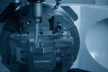 The 5-axis CNC milling machine  hole cutting on the metal mold part.