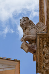 Statue of the winged lion, symbolic representation of the Evangelist Mark, on the façade of the...