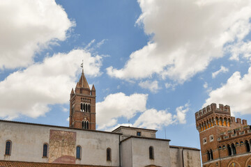 High-section of the Cathedral of St Lawrence and of Palazzo Aldobrandeschi with the towers against...