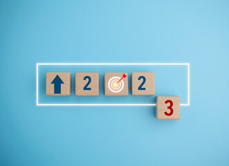 2023 on wooden block cube for preparation of new year change and start new business target strategy concept. Start the new year 2023 with a goal plan, and goal concept.