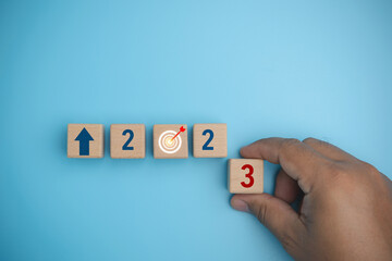 Start the new year 2023 with a goal plan, and goal concept. 2023 on wooden block cube for...