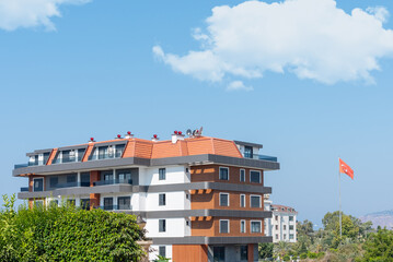 The exterior of an apartment building against the sky.