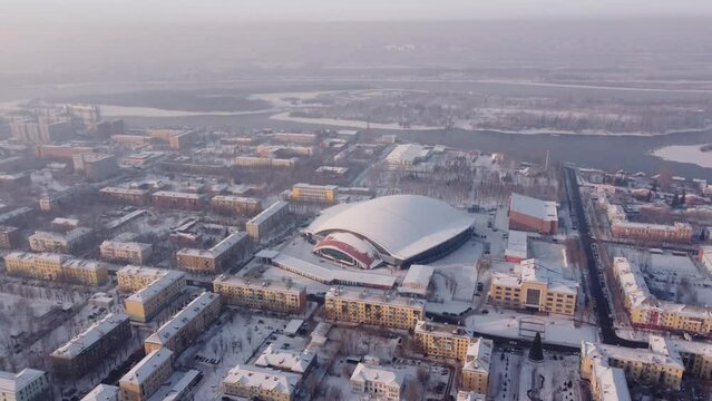 Russia, Krasnoyarsk. 20 November 2021: Sport Stadium Enisey. Home bandy arena Enisey club. Yenisei Ice Stadium, Krasnoyarsk from Drone.