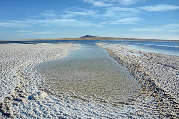 Fototapeta na wymiar View of the salt lake and blue sky. Beautiful landscape