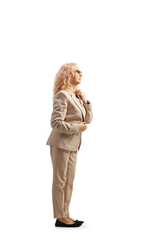 Full Length Profile Shot Of A Mature Woman Getting Ready And Sorting Her Clothes