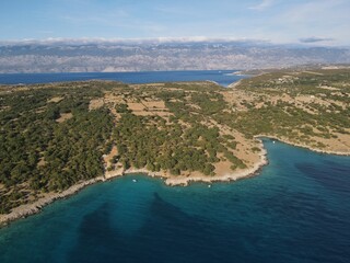 Aerial view of Potocnica, Lun and Novalja in island of Pag, archipelago of Croatia. Panoramic drone view of waterfront, idyllic and turquoise sea in Novalja, Adriatic Sea in Dalmatia region.
